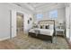 Serene main bedroom with tray ceilings, ample natural light, and a private entrance to the outdoor patio at 486 Broom Dr, Cumming, GA 30040