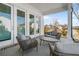 Inviting covered patio with comfortable seating and a view of the outdoors at 486 Broom Dr, Cumming, GA 30040