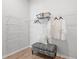 Walk-in closet offers ample storage with built-in shelving and an ottoman at 486 Broom Dr, Cumming, GA 30040