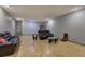Spacious basement featuring leather furniture and plenty of room for entertaining and activities at 51 Muirfield Ct, Hiram, GA 30141
