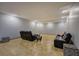 Finished basement featuring leather sofas and carpet at 51 Muirfield Ct, Hiram, GA 30141
