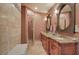 Elegant bathroom with double sinks, granite countertops, and tiled floors at 51 Muirfield Ct, Hiram, GA 30141
