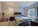 Bright bedroom with a comfortable bed, a window, and tasteful decorations at 51 Muirfield Ct, Hiram, GA 30141
