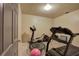 Home gym with a treadmill, elliptical, and other exercise equipment for convenient workouts at 51 Muirfield Ct, Hiram, GA 30141