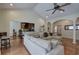Spacious living room open to the kitchen with hardwood floors and vaulted ceilings at 51 Muirfield Ct, Hiram, GA 30141