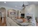 Open-concept living room with vaulted ceiling, a fireplace, and hardwood floors at 51 Muirfield Ct, Hiram, GA 30141