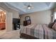 Spacious bedroom featuring tray ceilings, a ceiling fan, and a neutral color scheme at 51 Muirfield Ct, Hiram, GA 30141