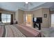 Main bedroom with ensuite bathroom, and large window providing natural light at 51 Muirfield Ct, Hiram, GA 30141
