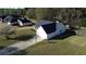 Aerial view of the home showcasing the driveway, spacious yard and surrounding neighborhood at 704 Manor Ridge Dr, Loganville, GA 30052