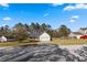 Charming single-story home with a front lawn, driveway, and attached garage at 704 Manor Ridge Dr, Loganville, GA 30052