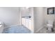 Modern bathroom with double vanity, large mirror, and stylish tile flooring at 12106 Conrad Cir, Hampton, GA 30228