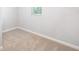 Bright, carpeted bedroom with neutral walls and a large window at 12106 Conrad Cir, Hampton, GA 30228