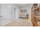 Neutral hallway area with beige furniture, a doorway and decorative bookshelf at 12106 Conrad Cir, Hampton, GA 30228