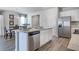 Open-concept kitchen with granite countertops, stainless steel appliances, and ample cabinet space at 12106 Conrad Cir, Hampton, GA 30228