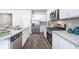 Well-equipped kitchen with stainless steel appliances, granite countertops, and modern fixtures at 12106 Conrad Cir, Hampton, GA 30228