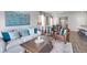 Cozy living room with comfortable seating, decorative pillows, and a large area rug at 12106 Conrad Cir, Hampton, GA 30228