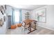 Inviting room with natural light, featuring a unique drafting table and stylish decor for a creative space at 12106 Conrad Cir, Hampton, GA 30228