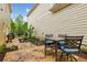 An outdoor patio with seating and a grill surrounded by landscaping at 4224 Gateland Ave, Marietta, GA 30062