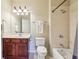 Bright bathroom features a vanity with wood cabinets and a shower-tub combination at 4224 Gateland Ave, Marietta, GA 30062