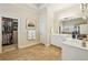 Bright bathroom with double sinks, vanity area, and access to a large closet space at 4224 Gateland Ave, Marietta, GA 30062