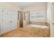 Spa-like bathroom with shower, soaking tub, and tile surround features a bright window at 4224 Gateland Ave, Marietta, GA 30062