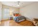 A cozy bedroom has neutral walls, hardwood floors, and a warm and inviting atmosphere at 4224 Gateland Ave, Marietta, GA 30062