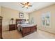 Inviting bedroom with neutral walls, carpet, ceiling fan, and shuttered windows at 4224 Gateland Ave, Marietta, GA 30062