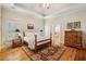 Spacious bedroom features trey ceiling, hardwood floors, a decorative rug and ensuite bath access at 4224 Gateland Ave, Marietta, GA 30062