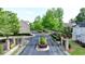 Gated community entrance with mature trees, manicured landscaping, and well-maintained street at 4224 Gateland Ave, Marietta, GA 30062