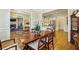 Spacious dining room adjacent to living room with chandelier and beautiful hardwood floors at 4224 Gateland Ave, Marietta, GA 30062