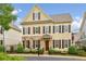 Beautiful exterior view of a home with yellow siding, stone accents, and well-manicured landscaping at 4224 Gateland Ave, Marietta, GA 30062
