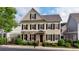 Charming two-story home featuring stone accents, neutral siding, dark shutters, and well-manicured landscaping at 4224 Gateland Ave, Marietta, GA 30062