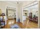 Elegant foyer with hardwood floors, chandelier, and a view into the kitchen and dining areas at 4224 Gateland Ave, Marietta, GA 30062
