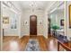 Grand front foyer showcasing hardwood floors, elegant lighting, and views into other rooms at 4224 Gateland Ave, Marietta, GA 30062