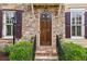 Detailed front entrance with stone steps, wood door, stone facade, and elegant lantern lighting at 4224 Gateland Ave, Marietta, GA 30062
