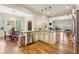 Open-concept kitchen with dining area, stainless steel appliances, and hardwood floors at 4224 Gateland Ave, Marietta, GA 30062