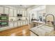 Modern kitchen with granite countertops, stainless steel appliances and white cabinets at 4224 Gateland Ave, Marietta, GA 30062
