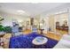 Elegant living room showcasing beautiful blue chairs, hardwood floors, and flows into a dining area at 4224 Gateland Ave, Marietta, GA 30062