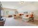 A large living room with carpet, a large sectional, and great natural light at 4224 Gateland Ave, Marietta, GA 30062