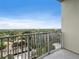 Balcony view of mature trees and neighborhood architecture beyond the railing at 923 Peachtree Ne St # 1334, Atlanta, GA 30309