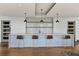 Stylish bar with mosaic backsplash, pendant lighting, and hardwood floors at 923 Peachtree Ne St # 1334, Atlanta, GA 30309