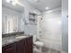 Modern bathroom features granite vanity top, new hardware, and bathtub with a shower at 923 Peachtree Ne St # 1334, Atlanta, GA 30309
