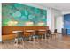 Chic cafe area with artistic murals, stylish seating, and warm lighting for a cozy ambiance at 923 Peachtree Ne St # 1334, Atlanta, GA 30309