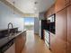 Kitchen featuring stainless steel appliances, dark granite countertops, and hardwood floors at 923 Peachtree Ne St # 1334, Atlanta, GA 30309
