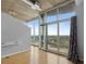 Sun-filled living room featuring large windows offering city views, hardwood floors, and modern design at 923 Peachtree Ne St # 1334, Atlanta, GA 30309