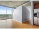 Bright living room with floor-to-ceiling windows showcasing city views and hardwood flooring at 923 Peachtree Ne St # 1334, Atlanta, GA 30309