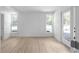 Finished basement with hardwood floors, neutral walls, and natural light at 3336 Myrtle St, Atlanta, GA 30354
