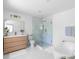 Spacious bathroom with double vanity, soaking tub, and glass enclosed shower at 3336 Myrtle St, Atlanta, GA 30354