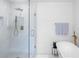 Bright bathroom with a glass shower, soaking tub, and modern fixtures at 3336 Myrtle St, Atlanta, GA 30354