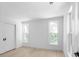 Bright, empty bedroom with wood floors, white walls, and a closet with sliding doors at 3336 Myrtle St, Atlanta, GA 30354